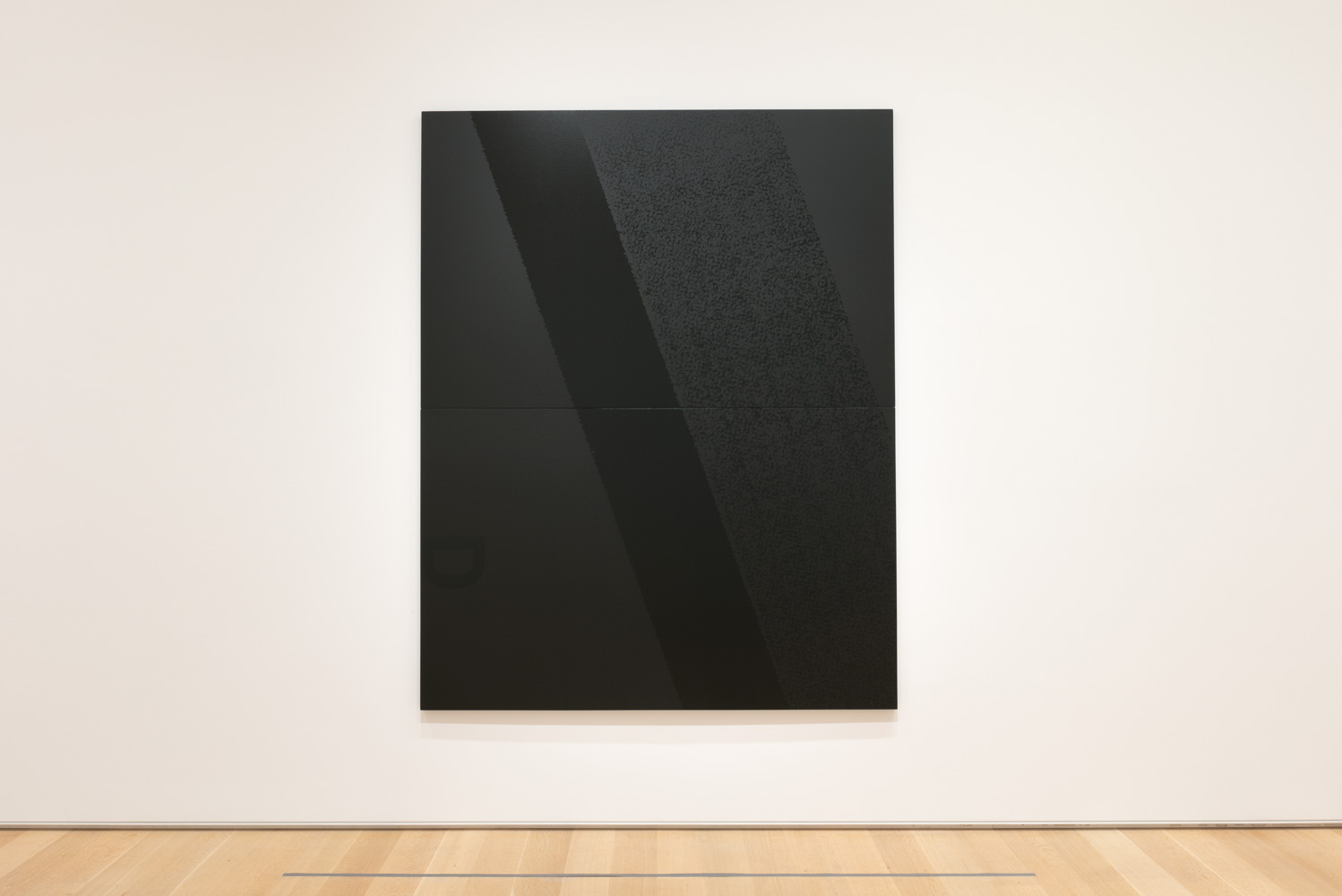 A silkscreen on canvas. The canvas is all black with subtle variations in pattern and color.