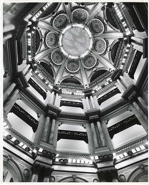A black and white photo of the interior of a large dome in the Federal Building.