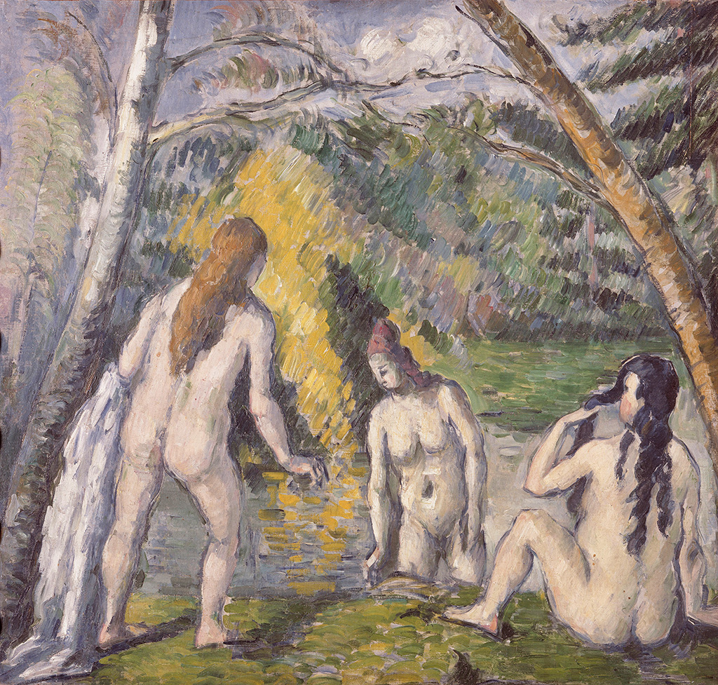 At the top, gray-blue sky with white clouds is crossed by brown tree branches, with dense green and yellow foliage below. In the foreground left to right, three nude adults with light skin are by shallow water: one stands facing away with long light-brown hair and a hand extended toward the water; the second kneels in the water with reddish hair; the third sits on the grass with long dark hair and a hand raised to the head. The trees are taller than the figures, and colors are mostly green and yellow with brown trunks and blue‑gray sky, with the water showing yellow‑green reflections.