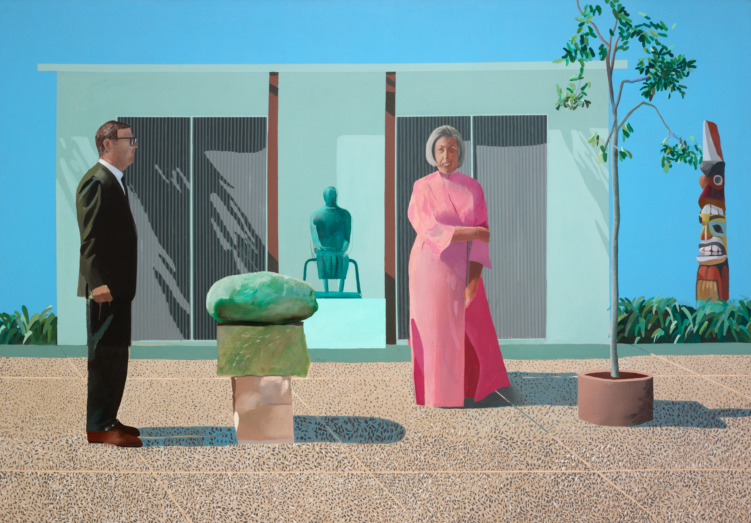 A painting of a light-skinned man in a suit and glasses standing in profile and a light-skinned woman with chin-length gray hair and wearing a full-length bright-pink robe stand in a courtyard with various sculptures. Between them is a large stone on a plinth, behind them a green abstracted seated figure, and off to the right a totem pole.