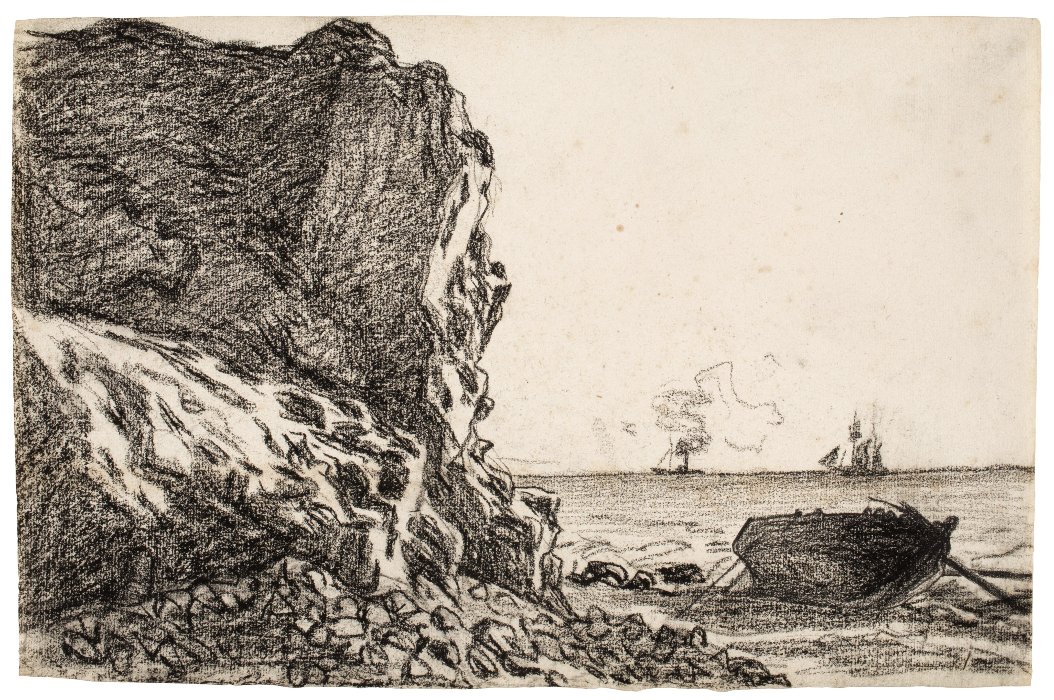 Left to right, a large rocky cliff occupies the left side, with light and dark gray streaks and a scatter of stones at its base. To the right, a wide stretch of water reaches a straight horizon, and a small dark rowboat rests on the shore in the right foreground. On the distant horizon near the center-right are two small boats, one with a faint puff of smoke and another with tall masts. The scene is rendered in black, white, and gray tones.