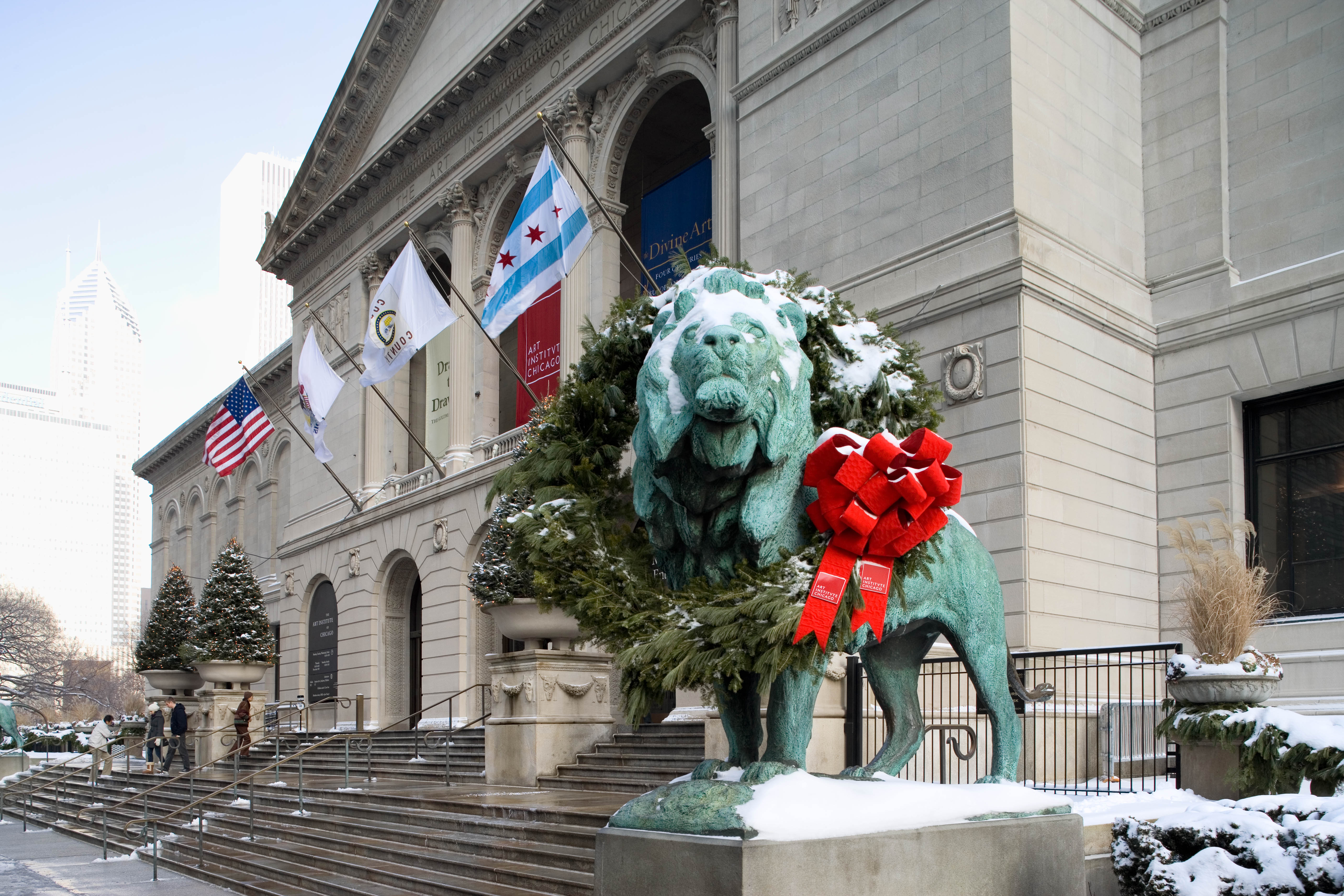 Lion wearing winter wreath