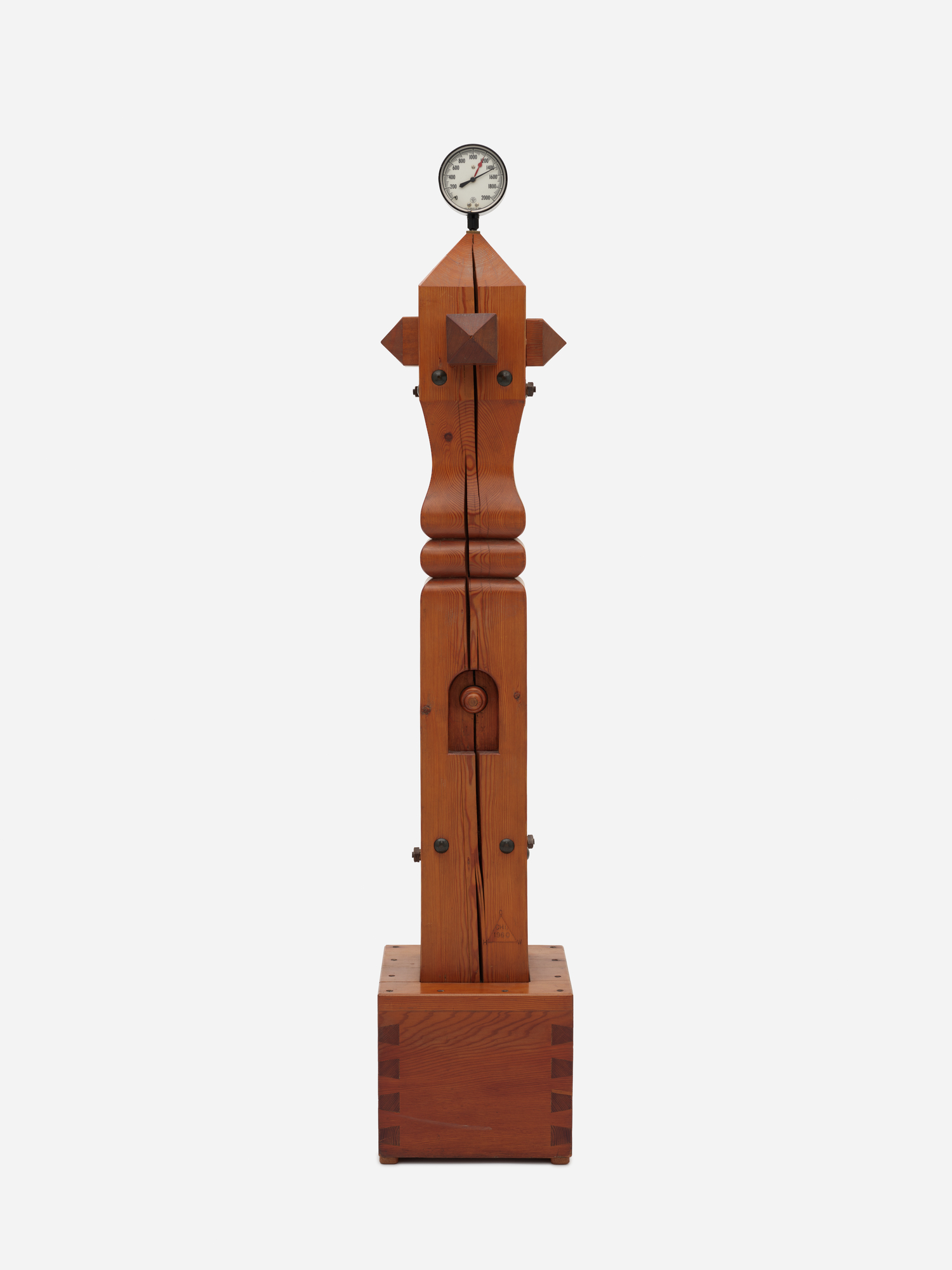 Vertical sculpture made of Douglas fir, metal, and pressure gauge