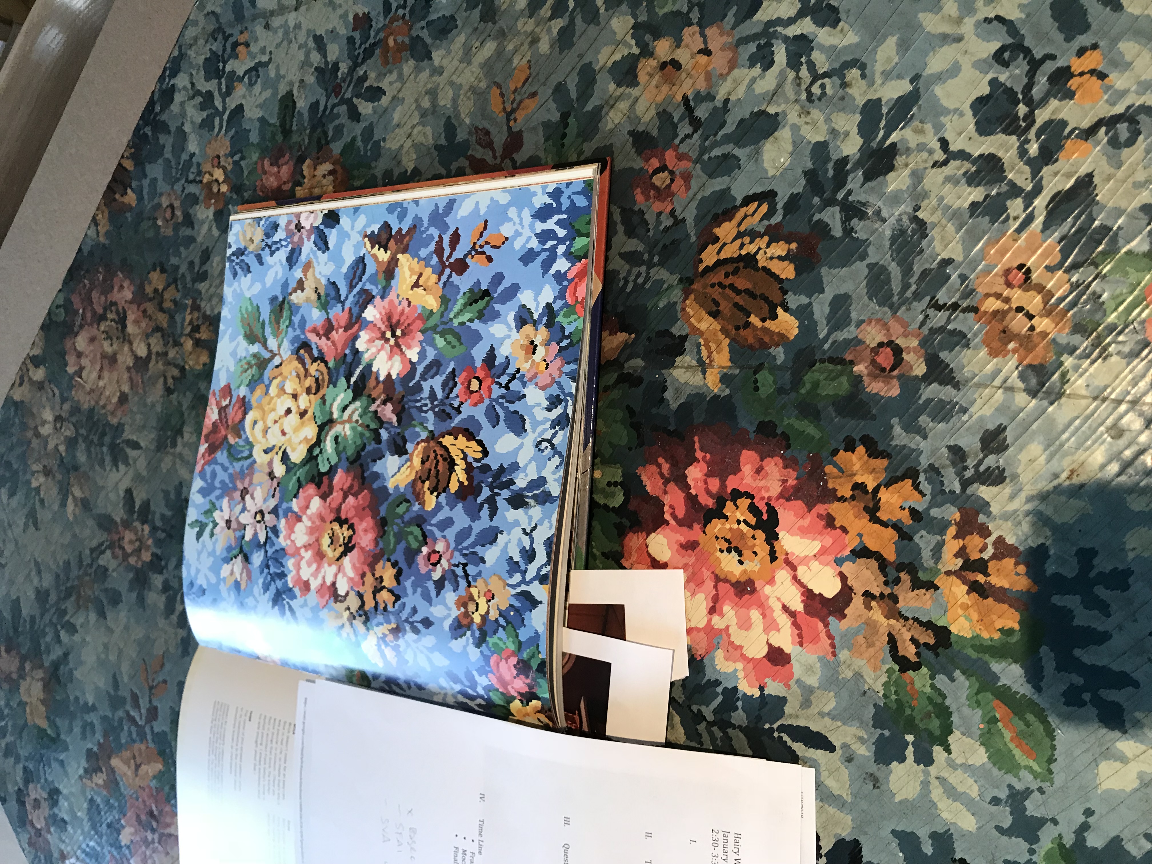 Image from book laid next to matching linoleum on floor