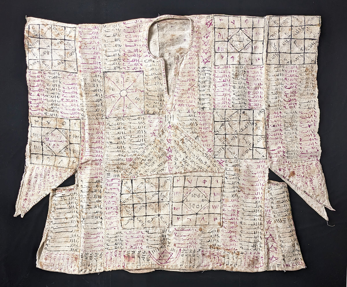 Ancient tunic with inscriptions laid out