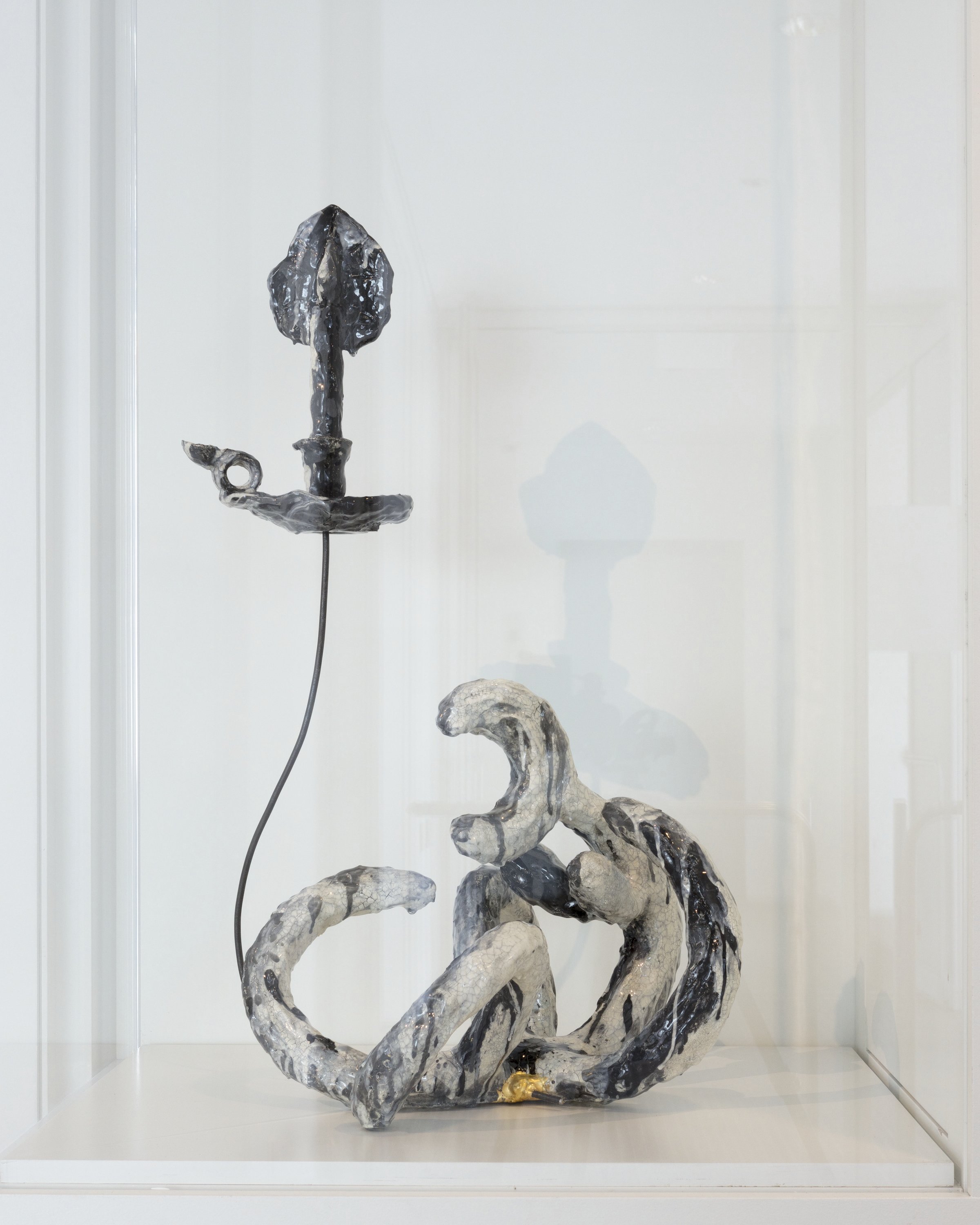 A photo of a sculpture of a candlestick.