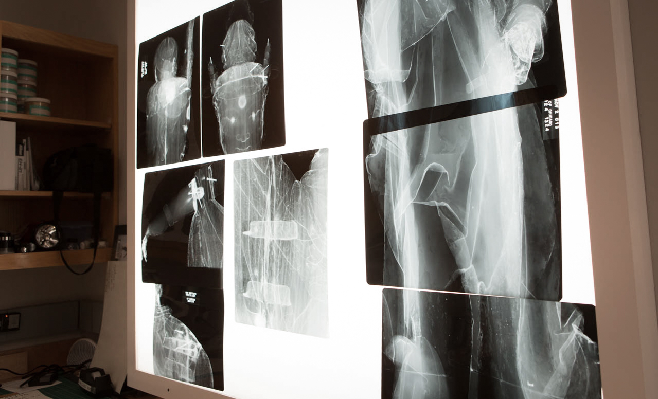 Shows X-ray images of a wooden bodhisattva that's in the process of conservation