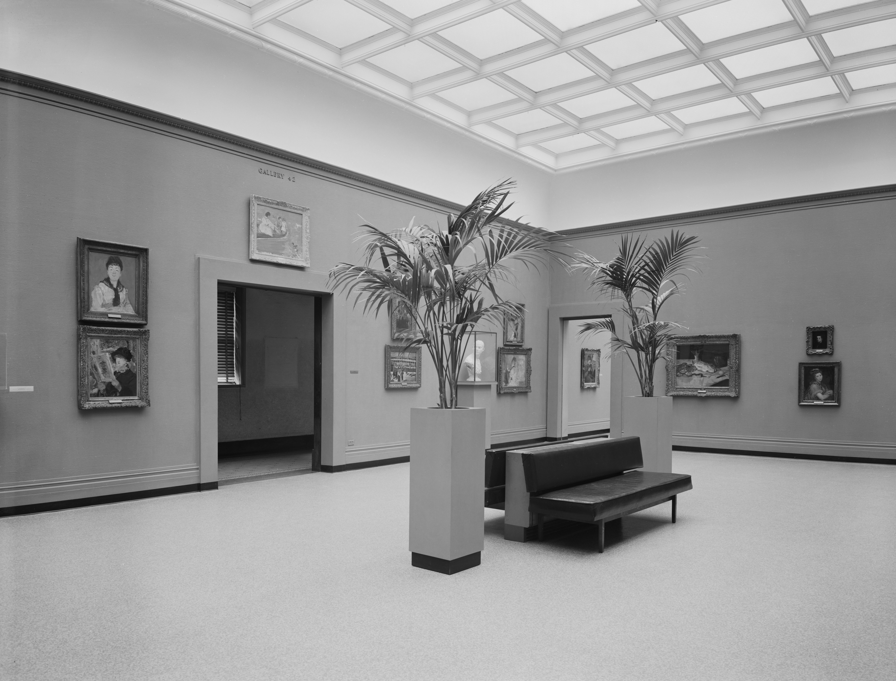 Old gallery in the Art Institute complete with bench and potted plants