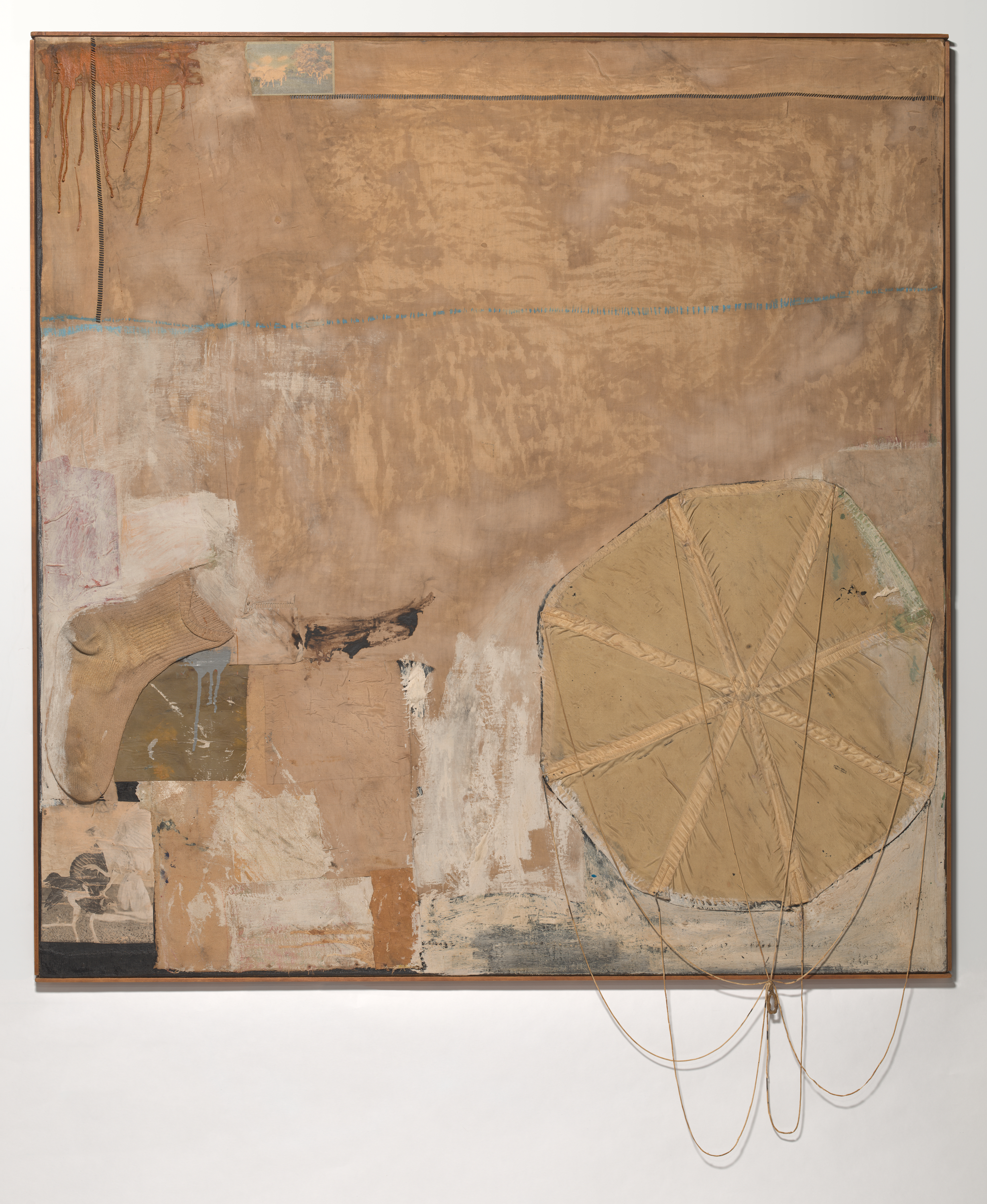 A painting-sculpture hybrid featuring a parachute and sock affixed to a canvas and painted beige, with blocks and areas of other earthy tones.