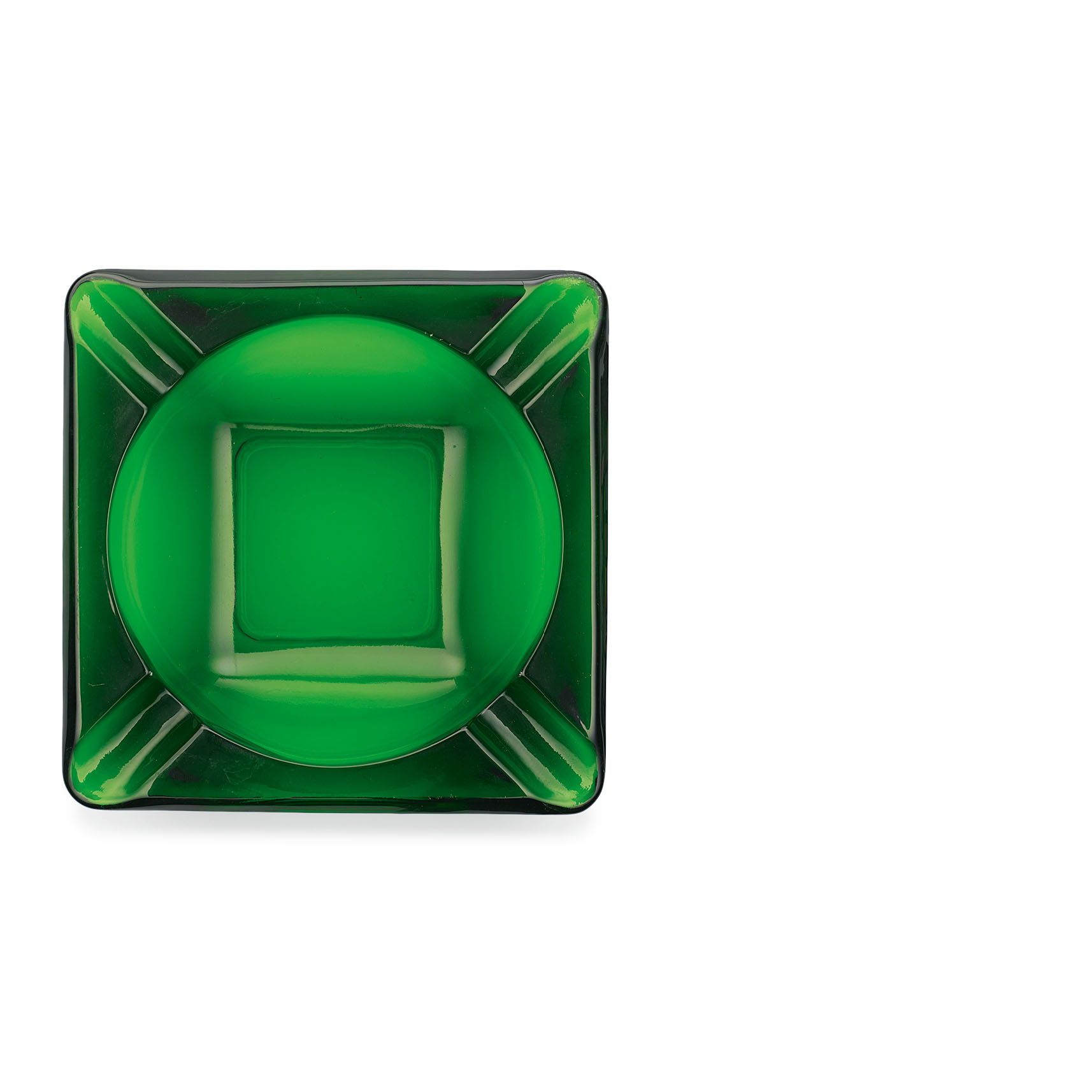 A green glass ashtray seen from above brings out the geometry of the object: the square of the ashtray itself, a central circular indentation, a smaller central square of its base, and wide lines to each corner.