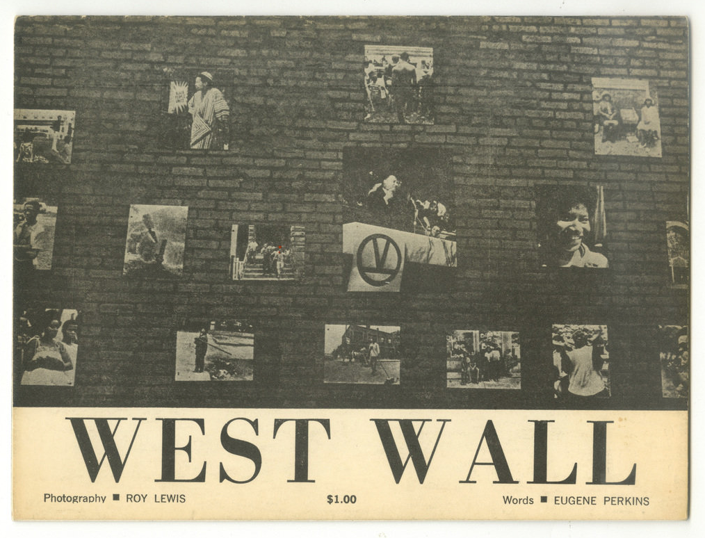 The image shows a brick wall with several black-and-white photographs displayed on it. The photographs are arranged in a grid, with varying images of people, events, and scenes. Some of the photos feature individuals in poses, while others show actions or settings related to protest or social movements. In the center of the image, there is a photograph of a woman standing with a sign. Below the grid, the words "WEST WALL" are prominently featured in large, bold text. The photo is credited to Roy Lewis for photography and Eugene Perkins for the words. The image is presented in a muted, vintage style.