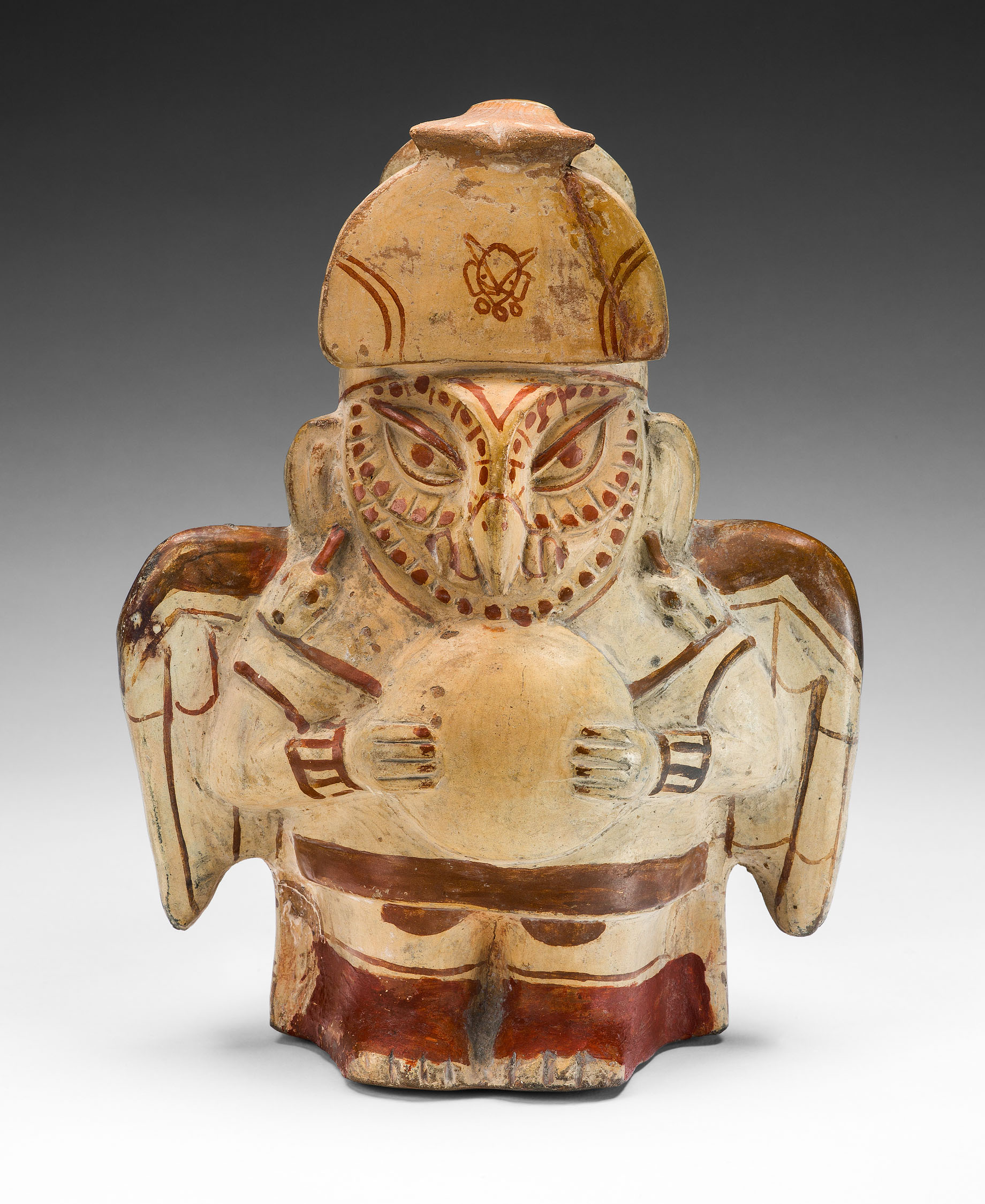 Small painted vessel in the form of a human dressed as an owl.