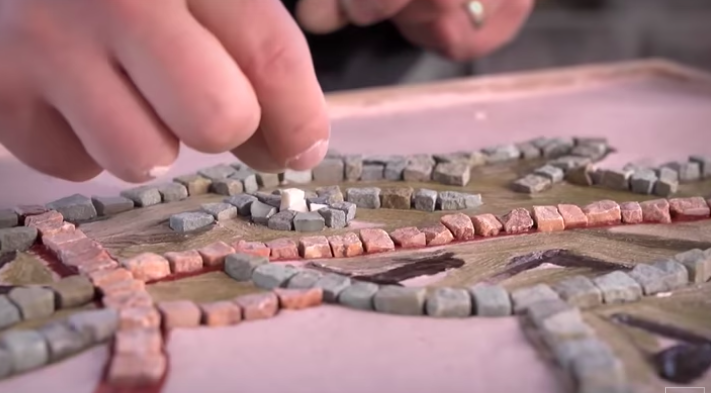 Replica of a Roman mosaic being paid out