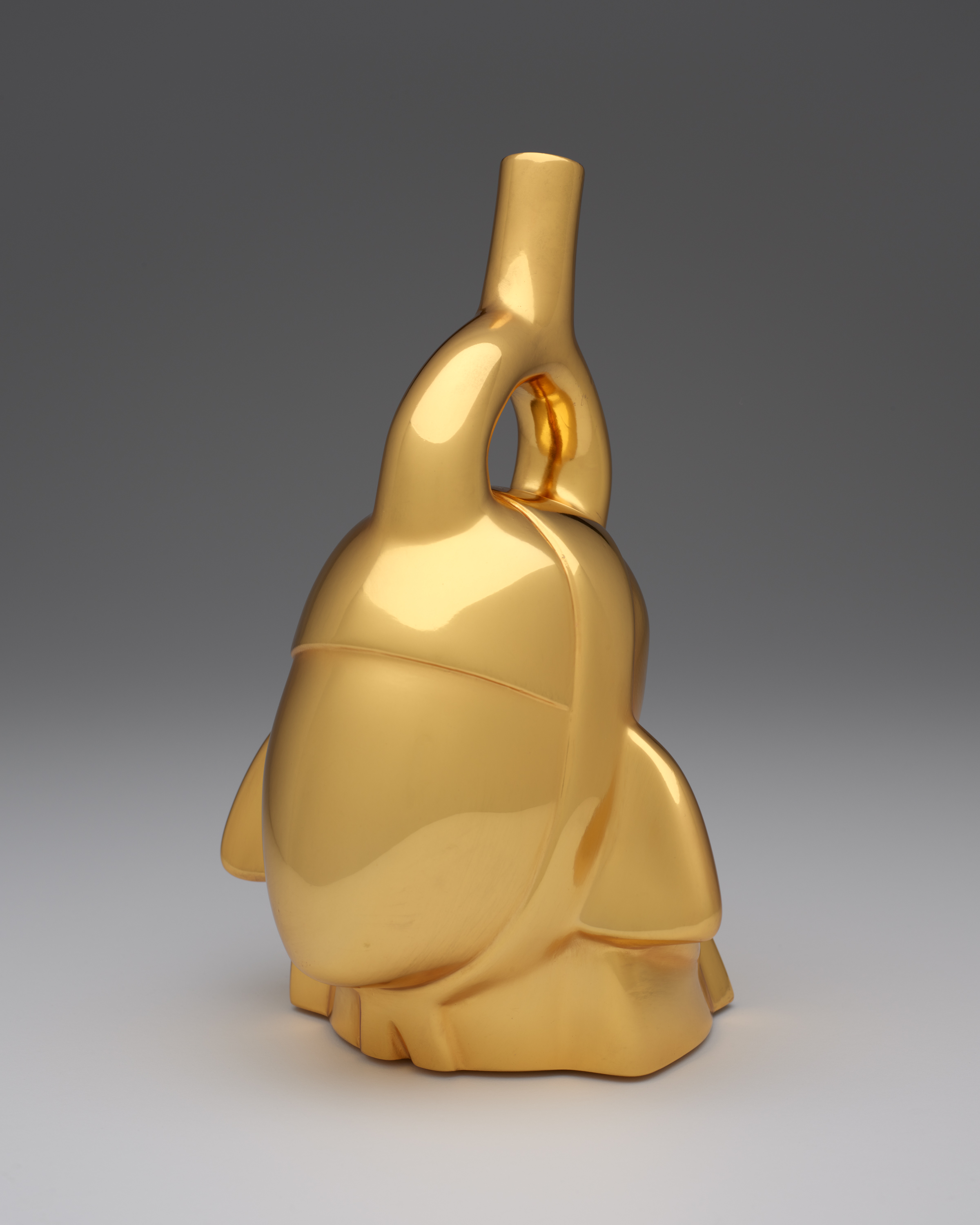 A solid gold version of a "protrait sculpture" bvut without any distinct features.