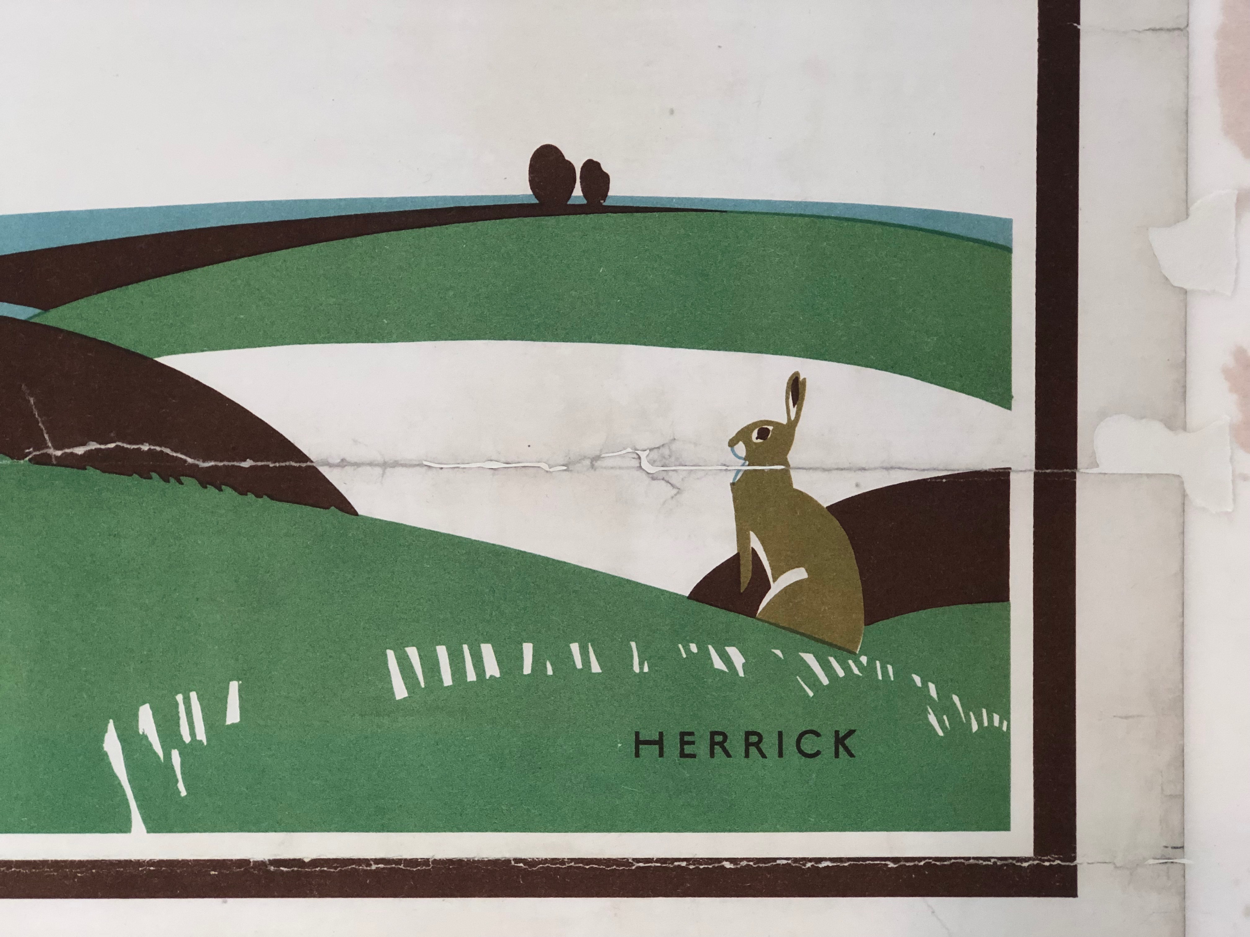 Details of tears and losses in the lower righthand corner of the poster that will be filled in and repaired.